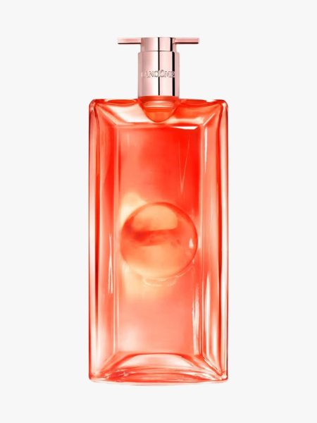 Bottle of Lancôme Idôle Peach 'N Roses Eau de Parfum with rose gold top on light gray background
